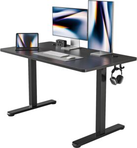 FEZIBO Height Adjustable Electric Standing Desk, 48 x 24 Inches Stand up Table, Sit Stand Home Office Desk with Splice Board, Black Frame/Black Top
